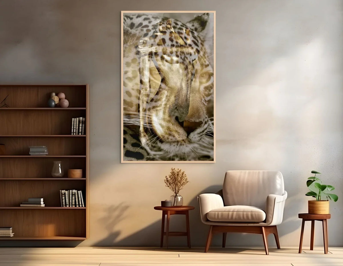 Leopard and gold-painted figure in a fine art photograph by Zack Zublena, framed above a cream armchair in a sunlit Los Angeles living room