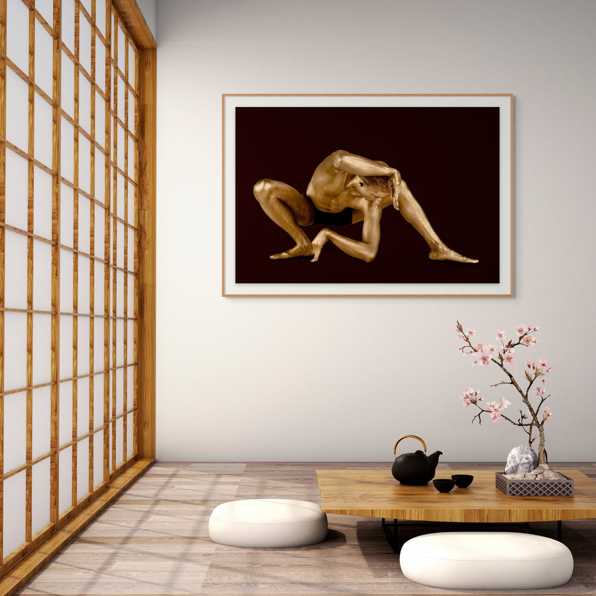 Framed gold-painted figurative photograph by Zack Zublena displayed in a serene Japanese-inspired meditation interior.