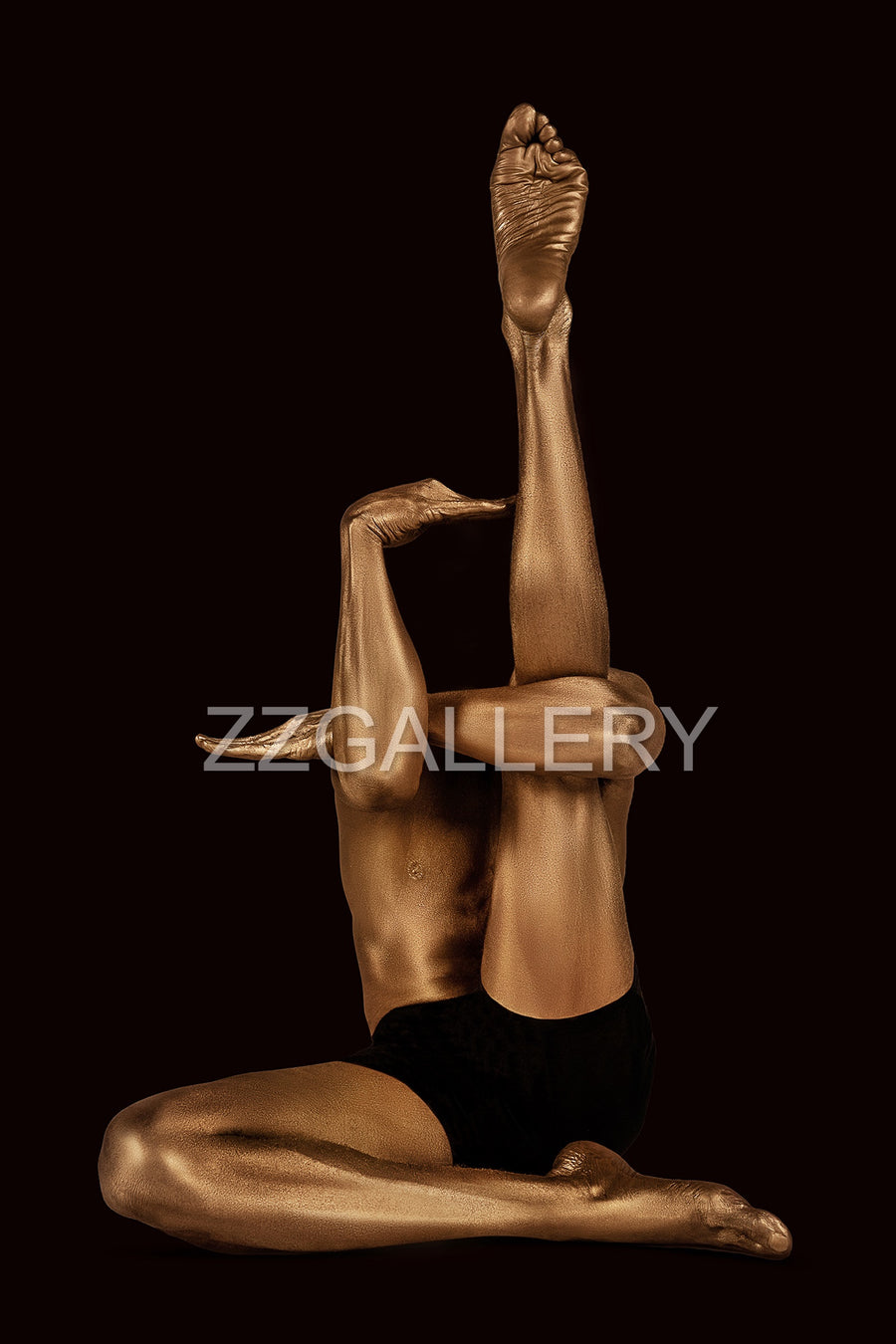 Golden-painted nude figure in an avant-garde yoga pose, legs extended upward, symbolizing meditation, transcendence, and quantum field awareness.