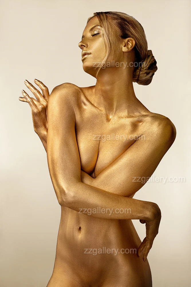 Luxury gold fine art wall print of a feminine portrait displayed in a modern bathroom interior with wooden wall paneling, black freestanding bathtub, and large window with natural view.