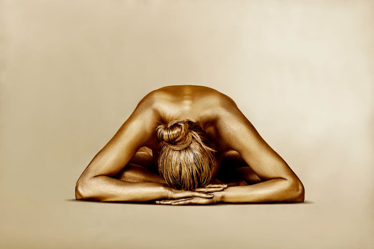 Royal Rest fine art photography by Zack Zublena featuring a gold painted body in a peaceful resting pose