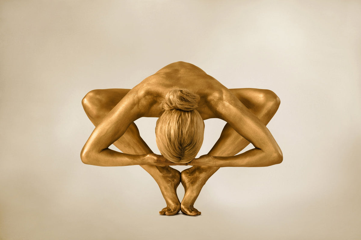 Golden-painted figure in a yoga star pose, contemporary fine art photography wall art décor by Zack Zublena.