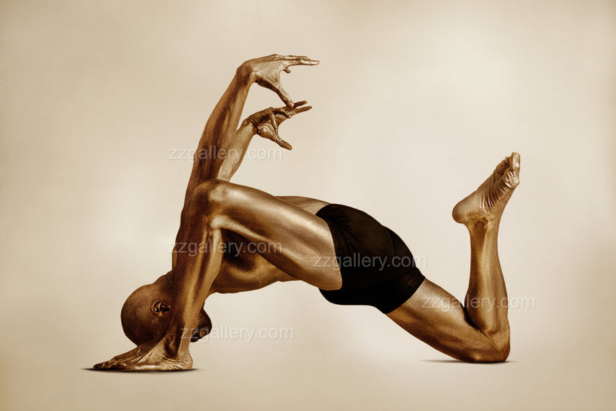 Golden-painted male figure in dramatic yoga bow pose, fine art photography highlighting strength, balance, and spiritual discipline for luxury wellness interiors.
