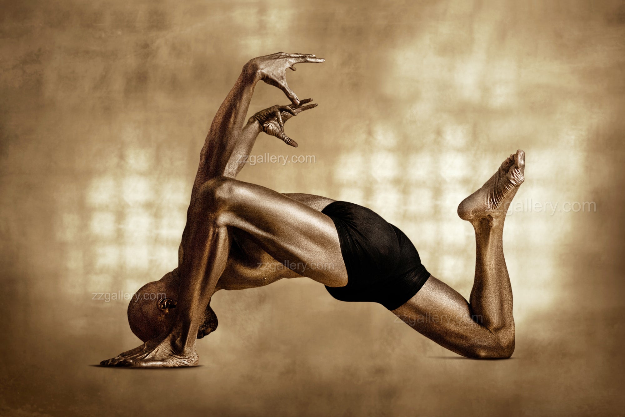 Golden Bull Pose – male figure painted in gold performing dynamic yoga posture, contemporary fine art photography by Zack Zublena