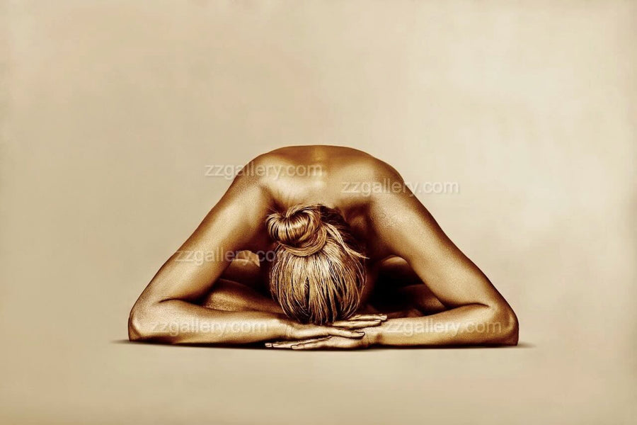 Golden-painted female nude in serene resting pose by Zack Zublena, contemporary fine art photography, luxury minimalist wall art symbolizing peace, surrender, and sacred feminine stillness.