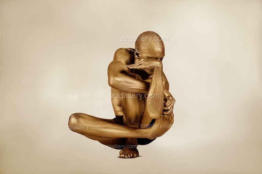 Golden-painted yogi in a sculptural meditative pose, fine art photography by Zack Zublena exploring quantum field states, minimalism, and transcendence.