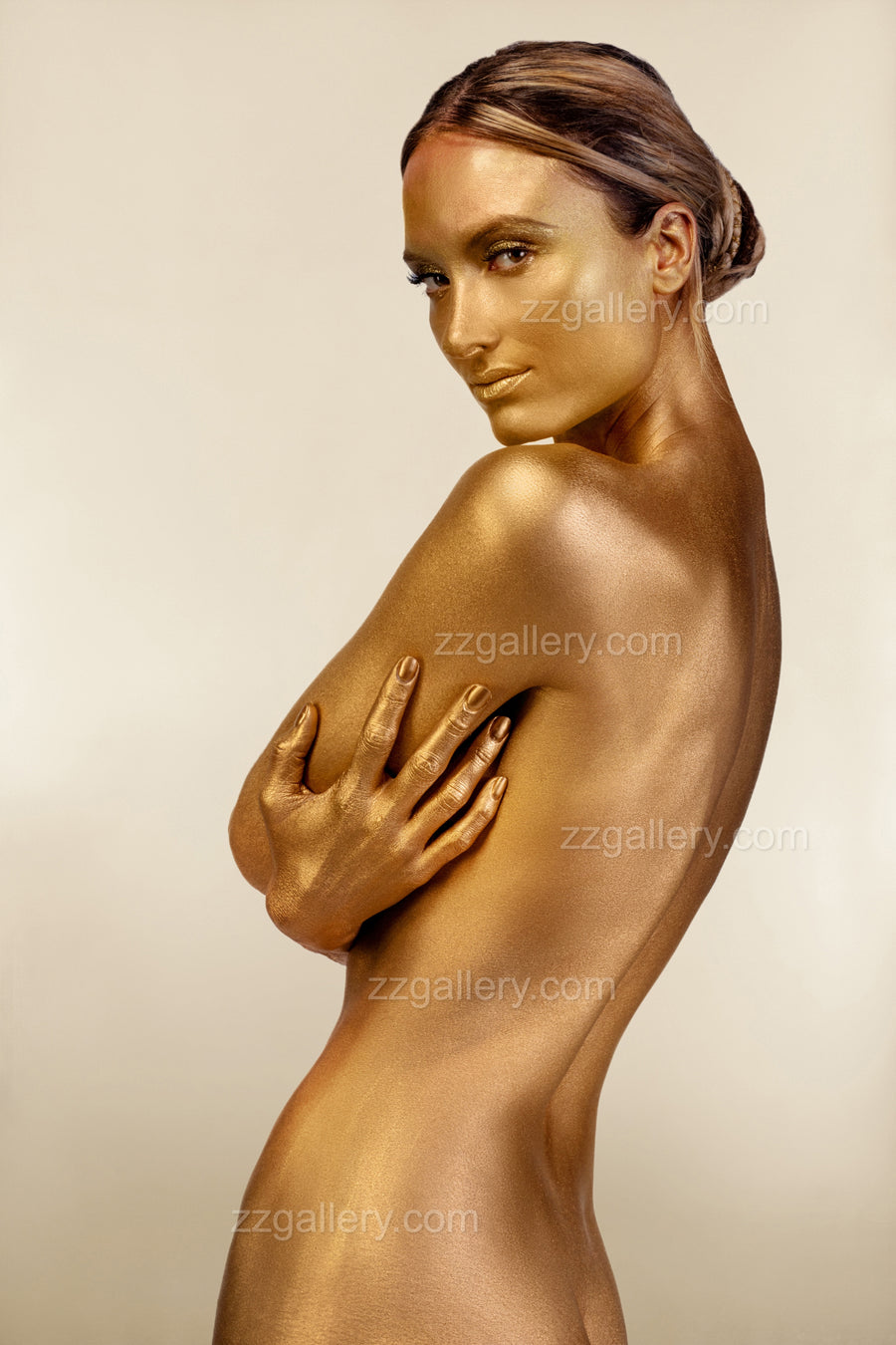 Golden silhouette fine art portrait with shimmering gold-painted skin, featuring an elegant hand gesture across the shoulder — luxurious contemporary wall art by Zack Zublena.