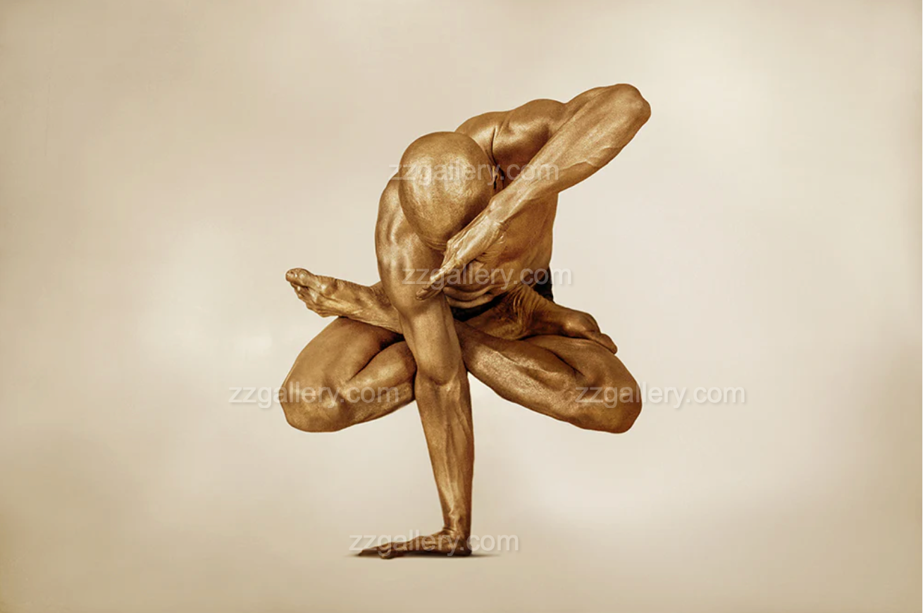Golden-painted man in lotus pose suspended mid-air – sculptural wall art