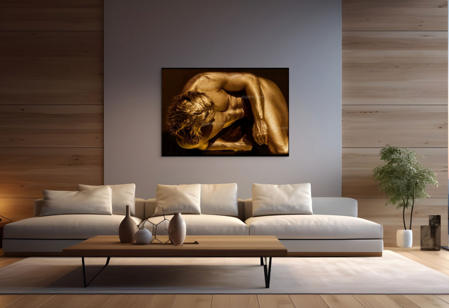 Golden-painted male figure in introspective pose by Zack Zublena, contemporary fine art photography, luxury wall art symbolizing strength, vulnerability, and meditative stillness.