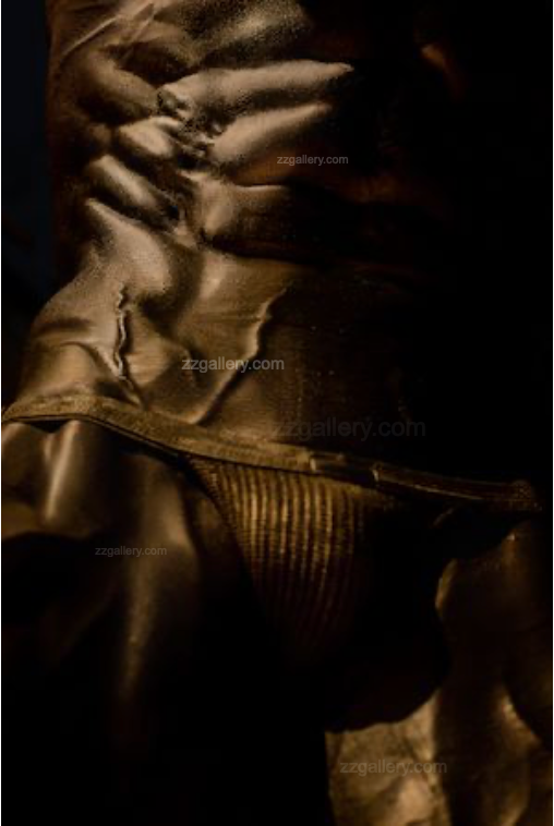 Golden muscular male abs and torso fine art print displayed in a modern interior with wood and cushions, luxury wall art for collectors, gym inspiration, wellness spaces, and contemporary design.