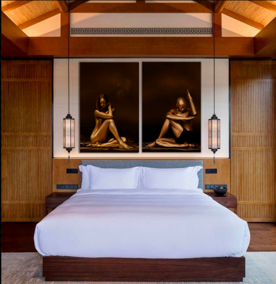 Golden silhouettes of a female and male yoga diptych artwork displayed above a luxury wooden bed in a serene resort-style bedroom.