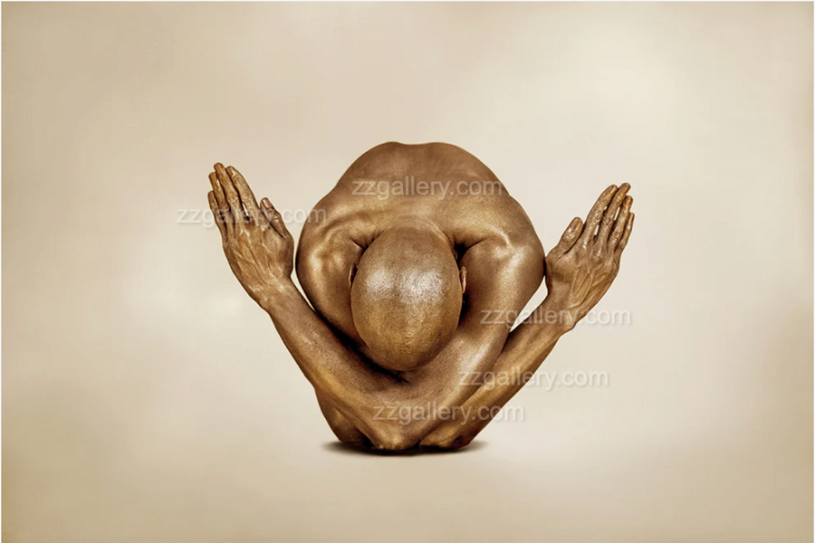 Golden-painted yogi figure in a bowing pose with arms crossed forward, symbolizing reverence and balance, contemporary fine art wall decor for meditation or spa interiors.