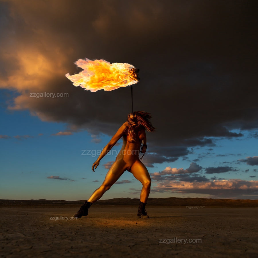 Interior view with framed fine art photograph Skyfall Flames III – Sacred Ignition by Zack Zublena, showing a golden-painted figure performing with real fire in El Mirage desert.