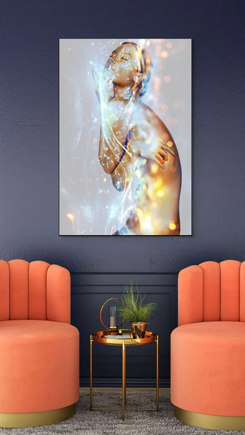 I Am Enlightened by Zack Zublena: gold-painted woman with eyes closed amid streams of light, displayed above a gold side table between two coral velvet armchairs against a navy wall.