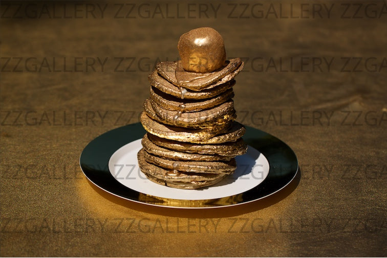 Fine art photograph of a golden stack of pancakes on a plate, symbolizing abundance and luxury, perfect as contemporary kitchen or dining room wall decor.