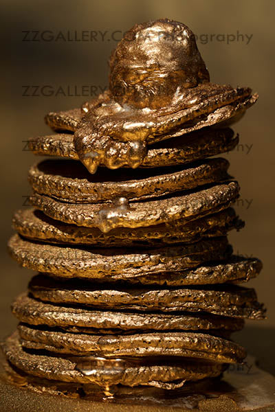 Golden pancake stack with melting topping – luxury fine art photography print for kitchen and dining wall decor.