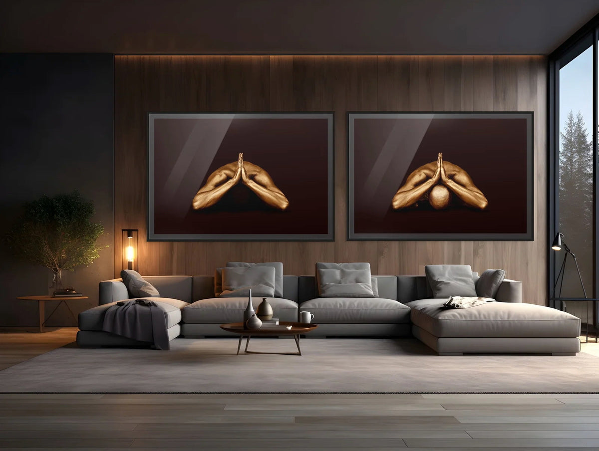 Modern luxury living room interior with a large grey sectional sofa featuring two framed golden fine art photography prints by Zack Zublena on a dark wooden wall.