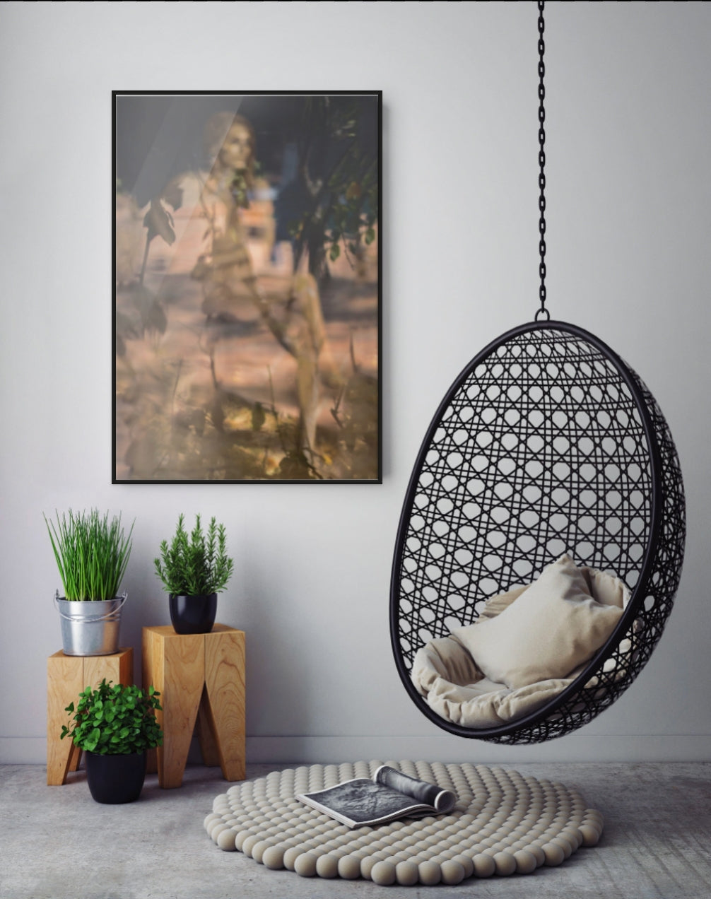 Modern Scandinavian interior featuring framed fine art photography above potted plants and a hanging chair by Zack Zublena.