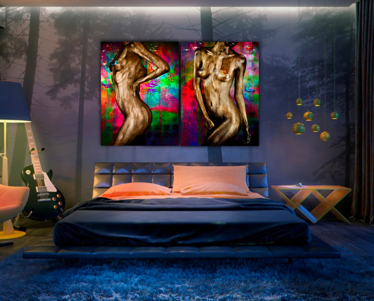 Gold fine art diptych by Zack Zublena: two gold-painted figures on a vivid neon abstract background, above a bed in a moody blue-lit bedroom