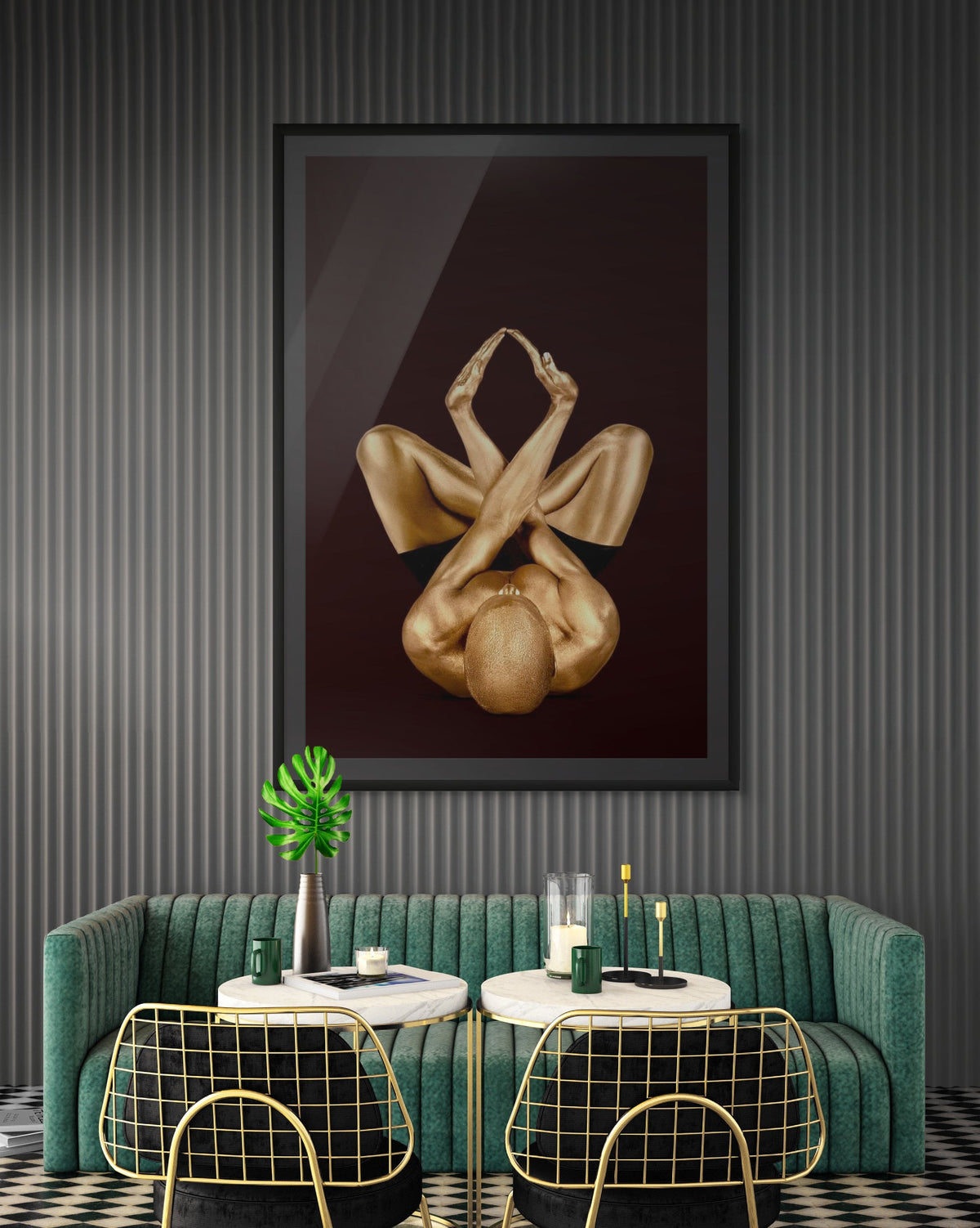 Gold-painted figure in a symmetrical folded pose, vertical fine art photograph by Zack Zublena above a green velvet banquette in a San Francisco lounge