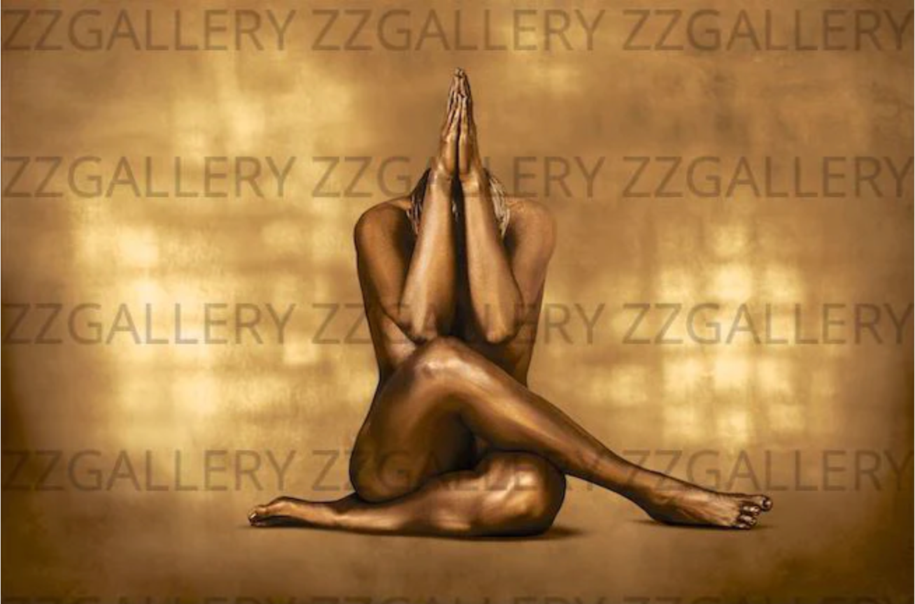 Feminine silhouette seated in gold body paint, cross-legged prayer pose on dark background by Zack Zublena for zzgallery.