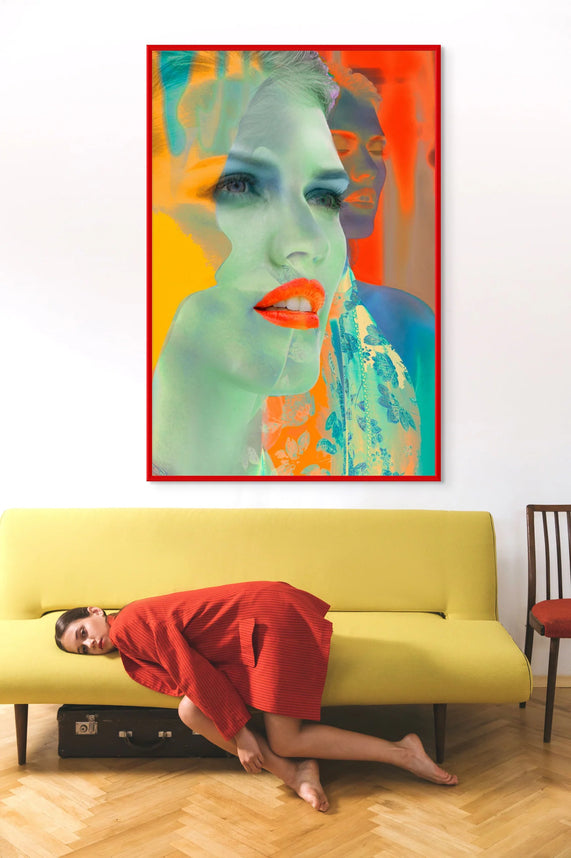 Inverted Dreams by Zack Zublena: colorful inverted portrait in a red frame above a yellow sofa in a bright living room.