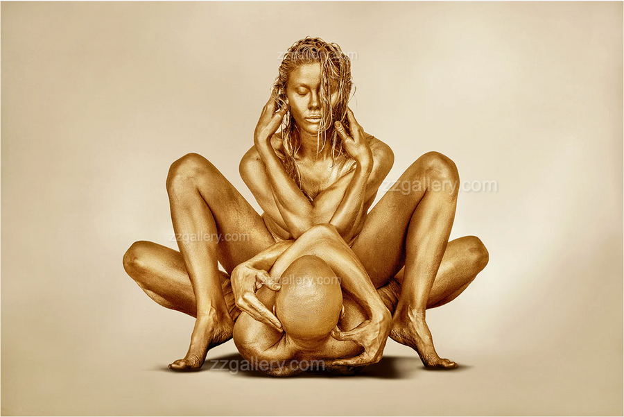Golden-painted couple in a sacred nude embrace, fine art photography by Zack Zublena symbolizing divine union, intimacy, and the balance of masculine and feminine energy.