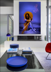 Virgin Mary in Gold fine art photography in blue background, featured in a sleek contemporary living room with glass walls and minimalist design inspired by The Chosen.