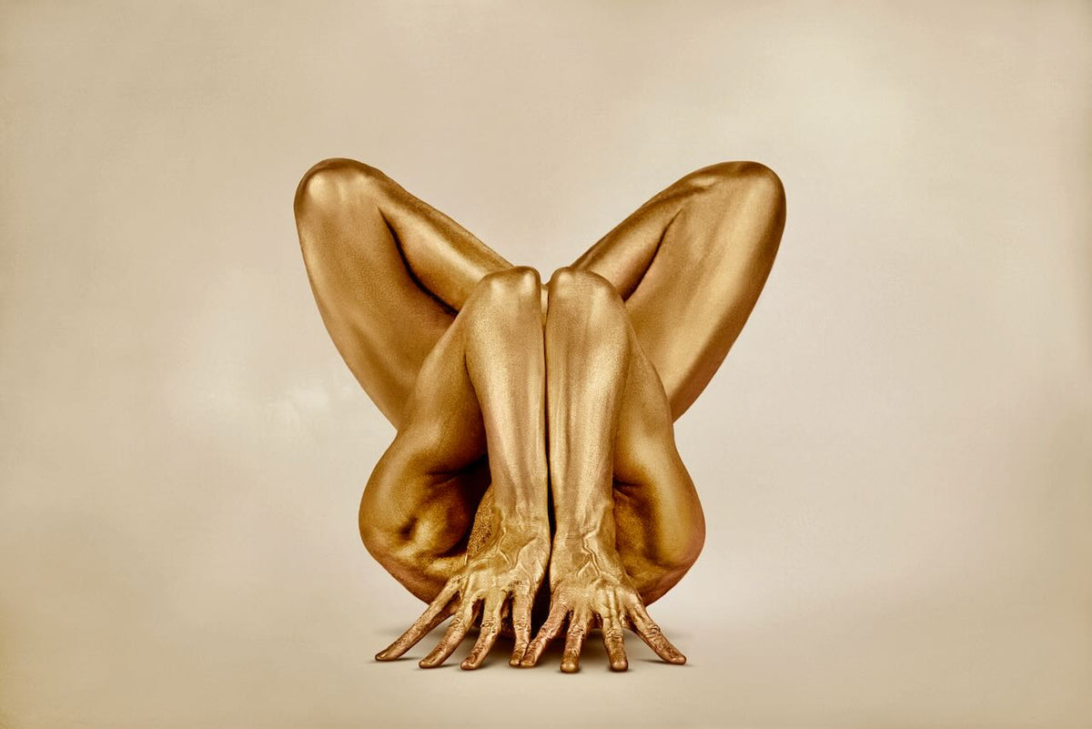 Wings of Infinity fine art photography by Zack Zublena featuring a gold-painted body forming a winged shape