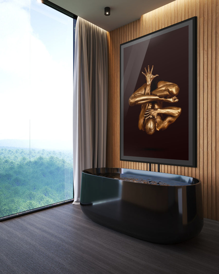 Fine art photography of a golden-painted figure in a yoga pose, arms extended upward, set against a dark background — moody sculptural artwork suitable for luxury interiors and modern spaces.