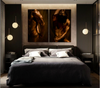 Modern bedroom with gay nude wall art triptych featuring golden masculine fine art photography, sensual male body painting for gay art collectors.