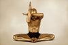 Gold-painted man in seated yoga pose with eagle arms, symbolic masculine wall art for spiritual or meditation decor
