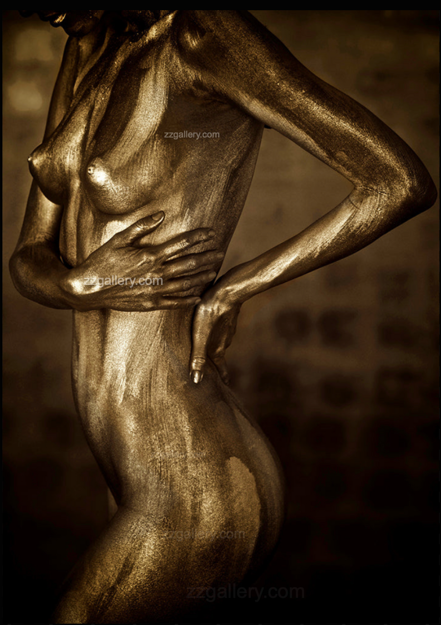Golden silhouette body art photography above a modern bedroom bed, featuring a metallic painted figure in a sculptural pose — luxury fine art wall decor for contemporary interiors