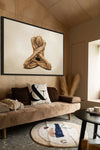 Golden-painted male figure in a meditative yoga pose with crossed arms, fine art photography for wellness centers, yoga studios, luxury interiors, and modern art collections.