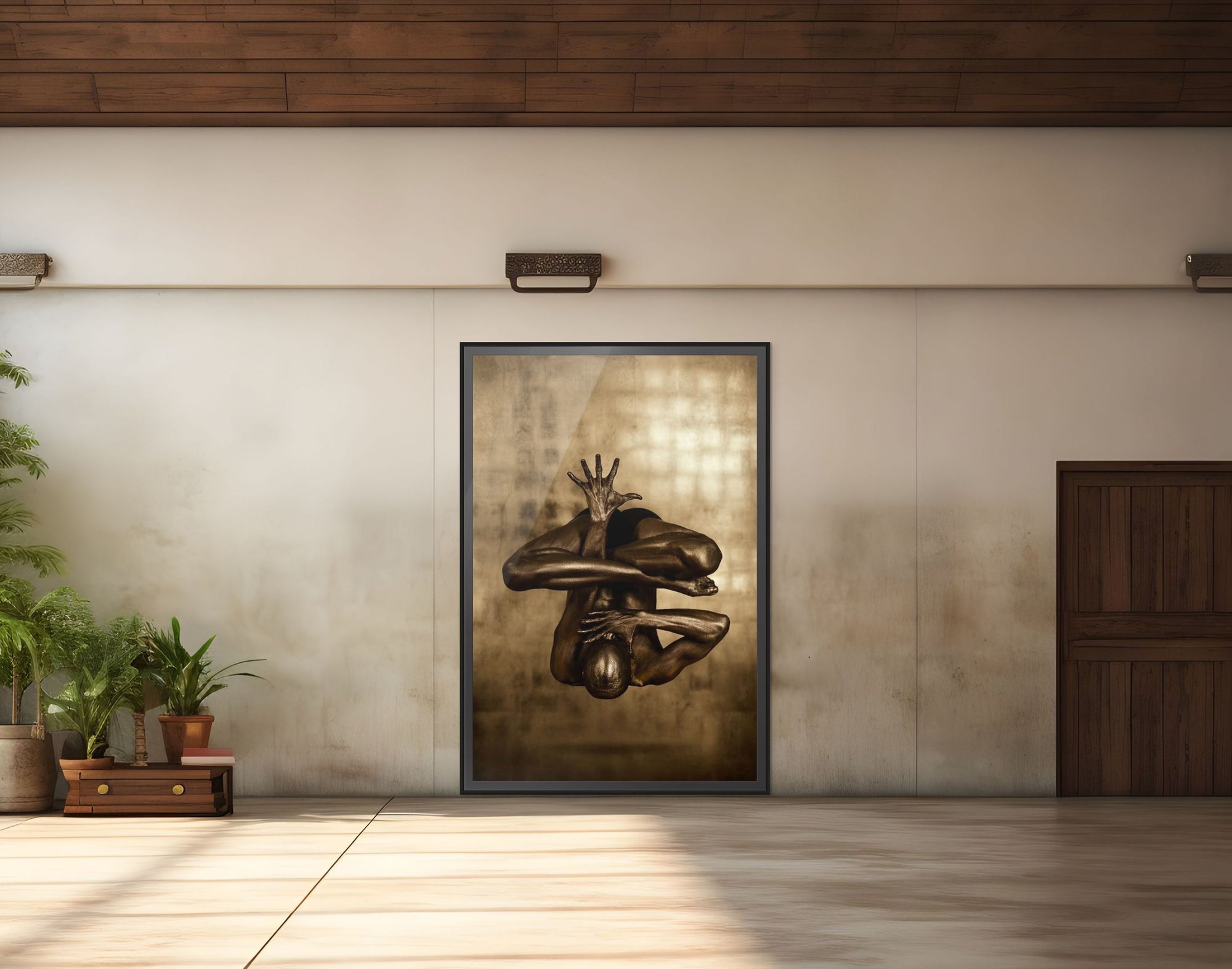 Golden-painted male figure captured in an abstract inverted pose with expressive hand gesture — contemporary fine art wall photography by Zack Zublena, ideal for luxury interiors and modern collectors.