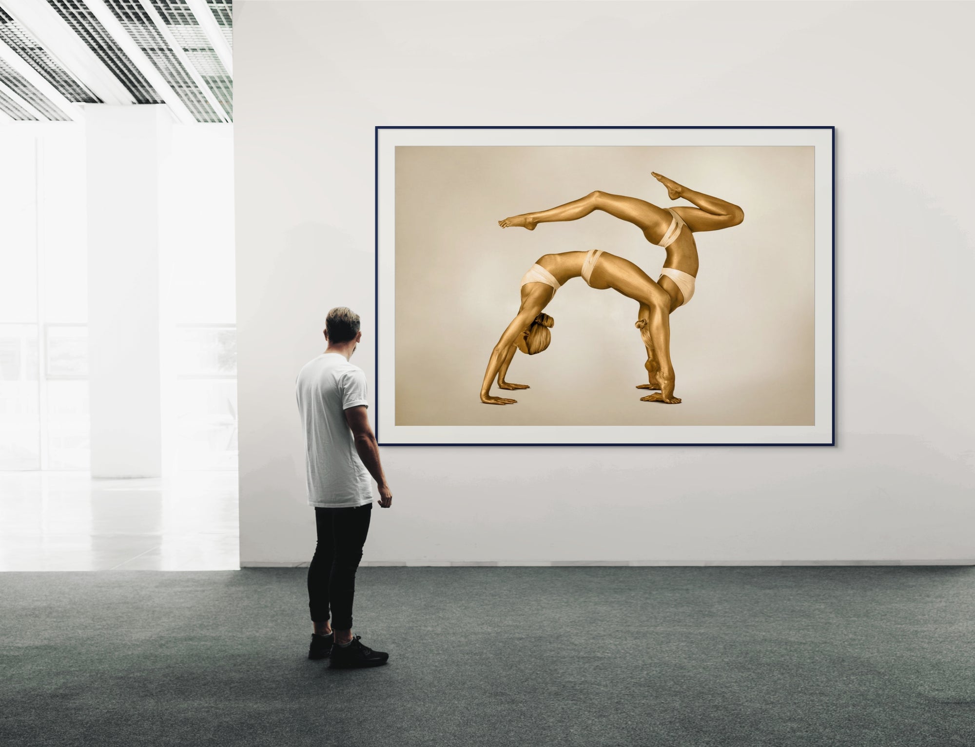 Golden-painted female duo in an acrobatic yoga arch pose, captured as contemporary fine art wall décor. An elegant composition emphasizing balance, harmony, and feminine strength. Perfect for luxury interiors, yoga studios, wellness spaces, and modern art collectors.