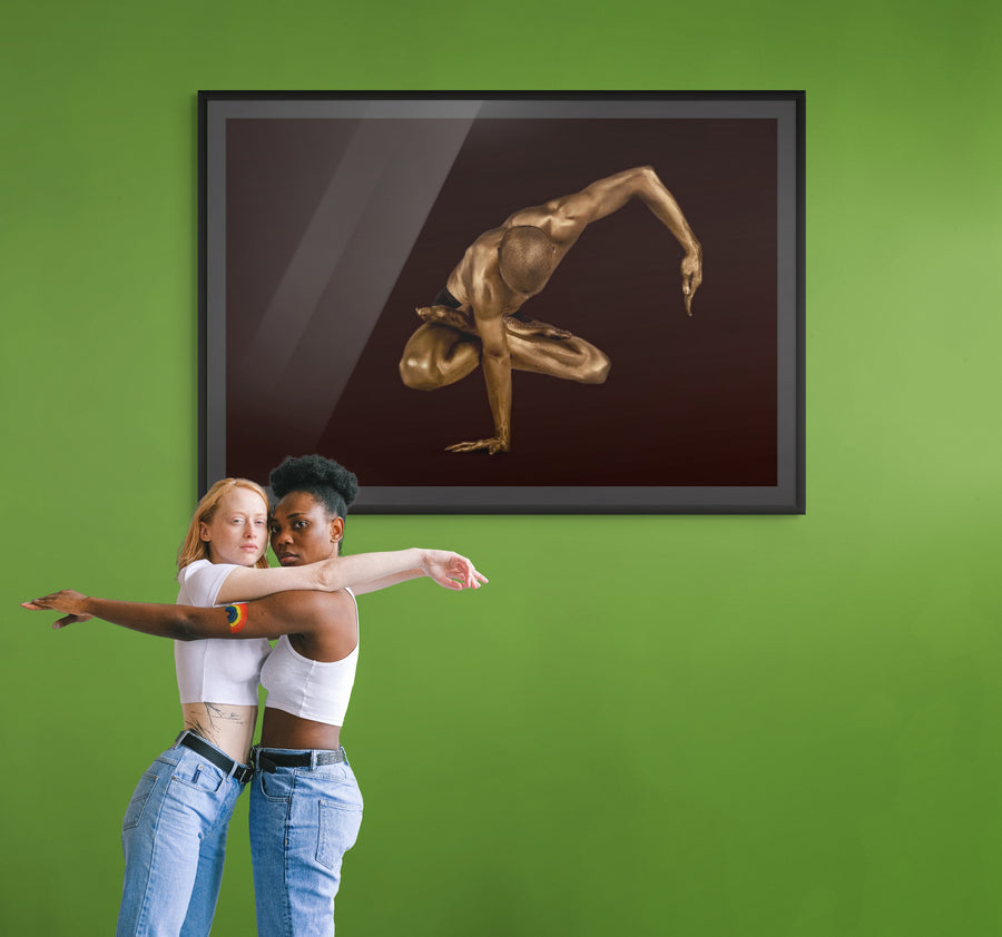 Golden-painted male figure captured in a one-arm balance pose with sculptural precision, evoking strength, grace, and equilibrium — fine art photography by Zack Zublena, ideal for luxury interiors, spas, and wellness clubs.