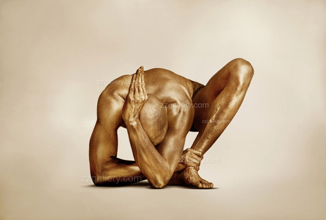 Golden-painted male figure in a sculptural yoga pose, fine art photography emphasizing strength, balance, and elegance. Contemporary wall art for luxury interiors, spas, and collectors.