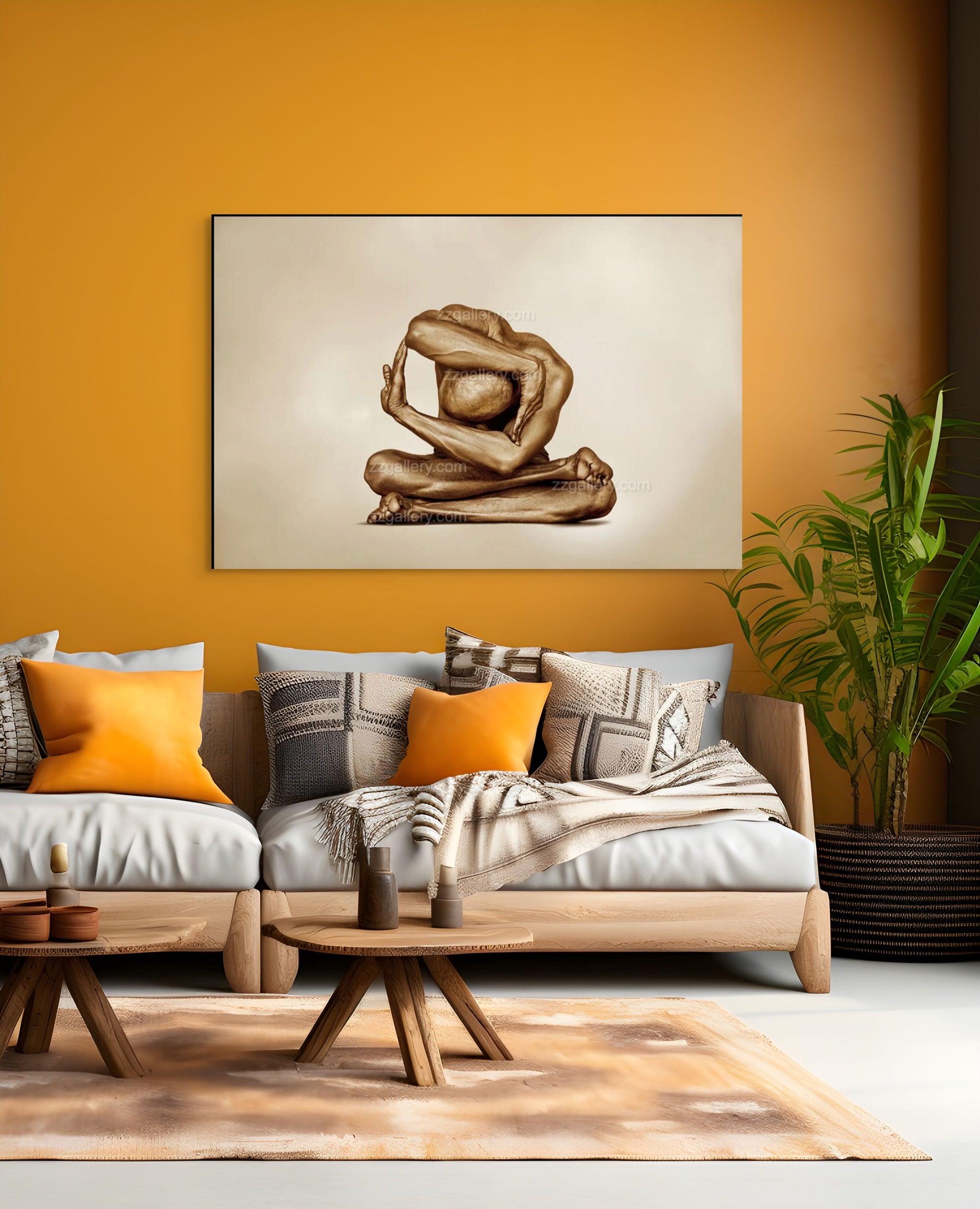 Golden-painted figure in a circular yoga pose, shimmering in gold tones, displayed above a modern sofa with orange accents.