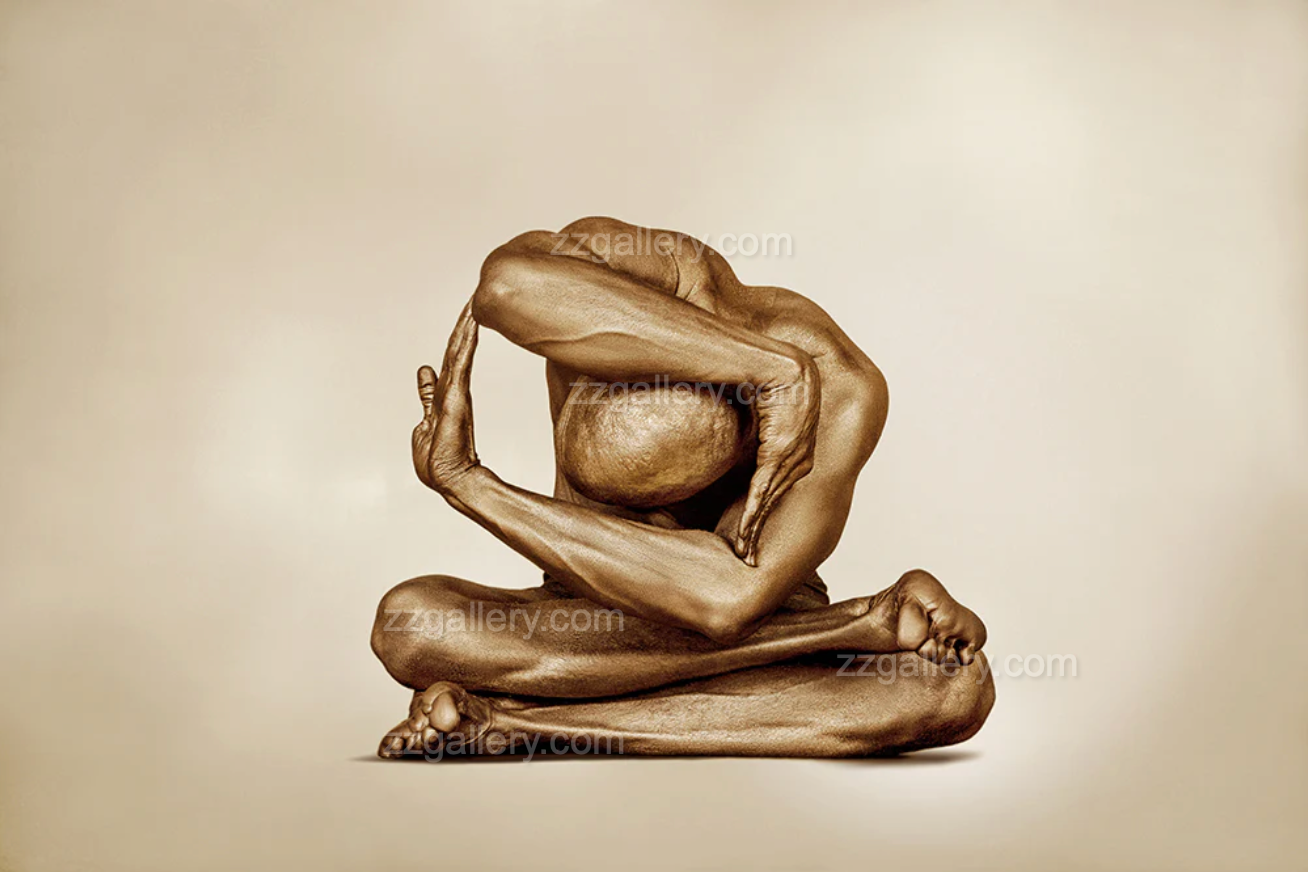 Golden-painted male figure in a folded geometric seated pose, expressing sacred containment, inner stillness, and spiritual strength.