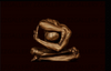 Golden nude male figure in advanced meditative yoga pose on dark background, sculpted in symmetry and stillness by Zack Zublena. Luxury fine art photography for modern interiors, meditation spaces, and spiritual wellness design.