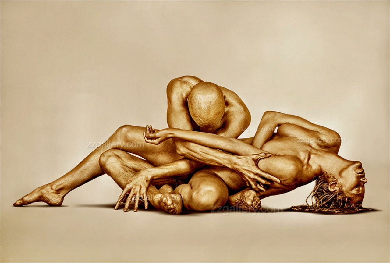 Golden-painted couple in abstract sculptural pose, fine art photography for luxury wall decor and modern interiors.