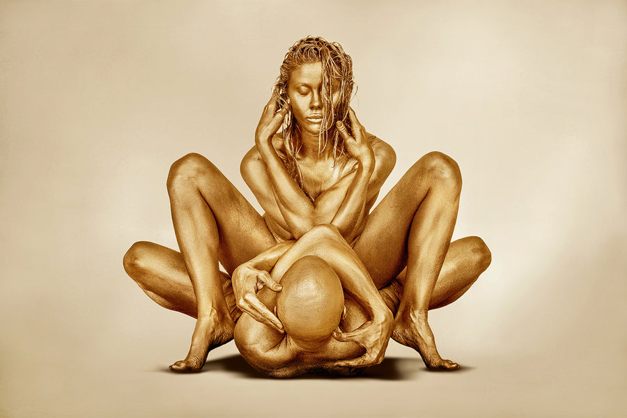 Golden nude couple in a sacred intertwined position symbolizing infinity, unity, and divine connection.