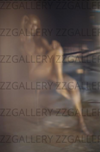 Golden-painted nude female in soft blurred light, surreal fine art photography, sensual dreamlike wall decor for luxury hotels, spas, and collectors.