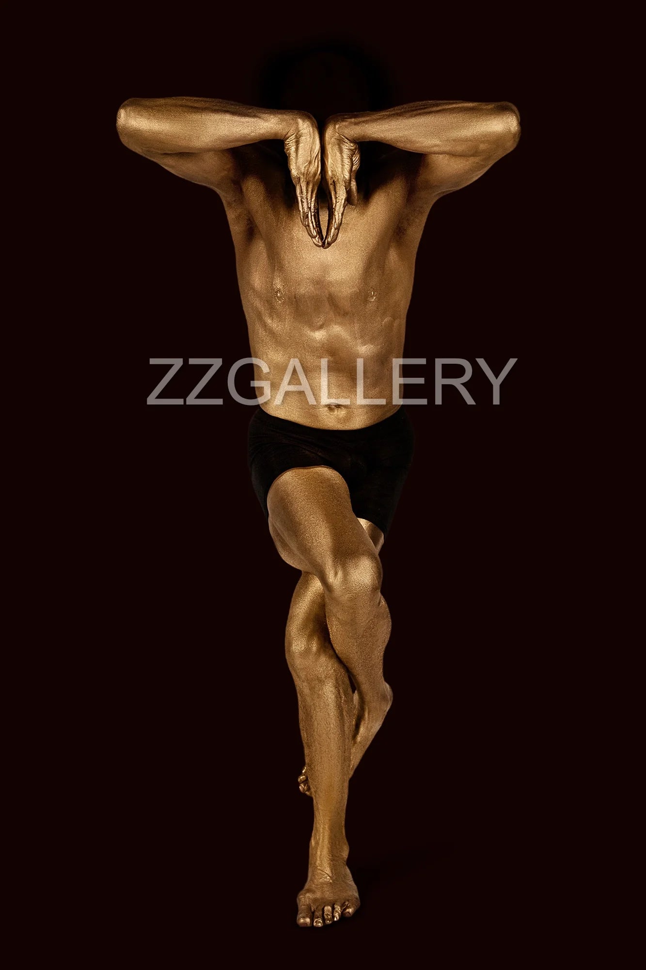 Golden-painted figure in quantum meditation pose with obscured face – Zack Zublena conceptual fine art