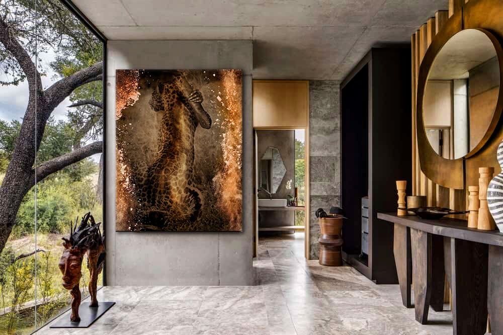 Golden Embrace with Leopard by Zack Zublena, fine art wall photograph featuring a golden-painted figure merging with a leopard, displayed in a contemporary home interior with natural light and elegant design.