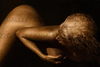 Golden female nude with curved sensual pose, luxury fine art wall decor