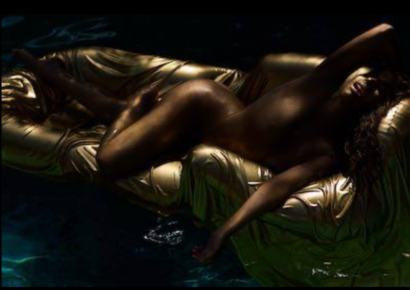 Golden female nude on gold float, luxury erotic fine art photography, sensual feminine wall art, divine feminine nude photography