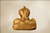 Two golden-painted female nudes—one seated upright, one lying sideways—posing in serene harmony, ideal for spiritual and luxury wall art decor.
