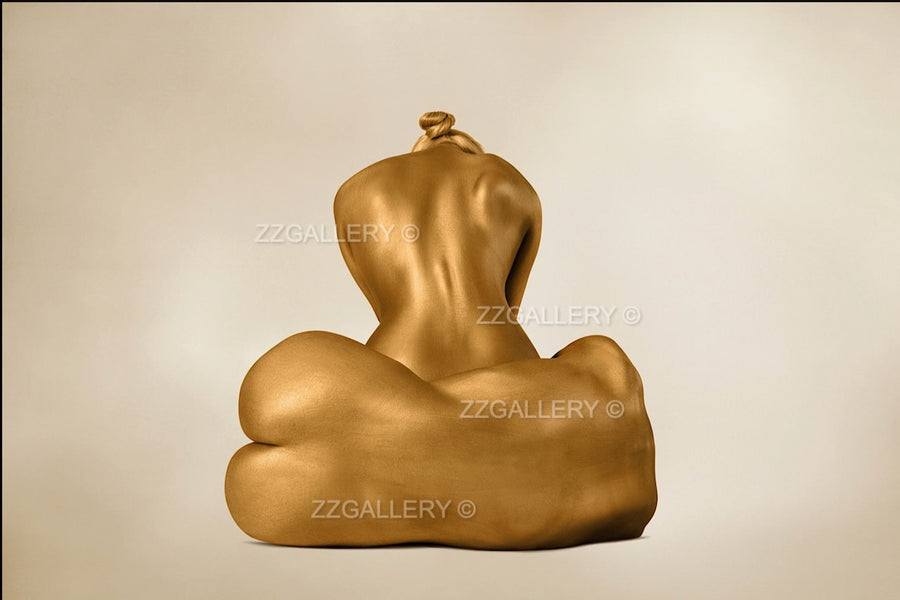 Two golden-painted female nudes—one seated upright, one lying sideways—posing in serene harmony, ideal for spiritual and luxury wall art decor.